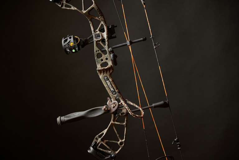 Close-up of a compound bow against a dark background, know the parts of a bow concept. 