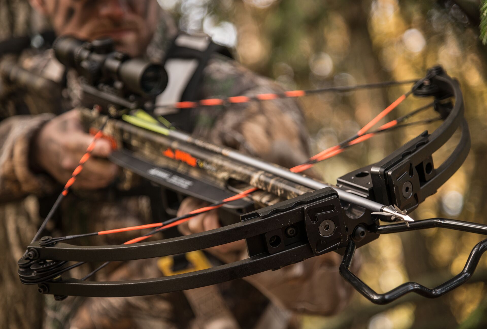 Close-up of a crossbow loaded with an arrow, bowhunting concept. 