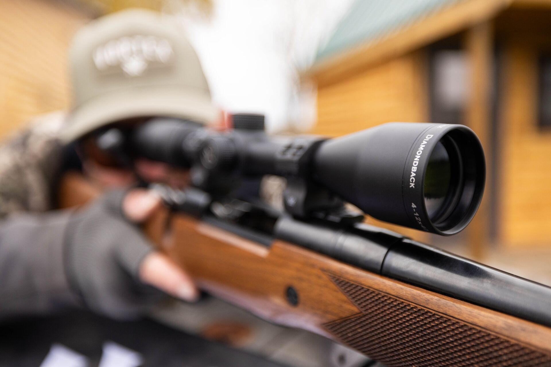 A hunter aims a hunting rifle, improving shooting for accuracy concept. 