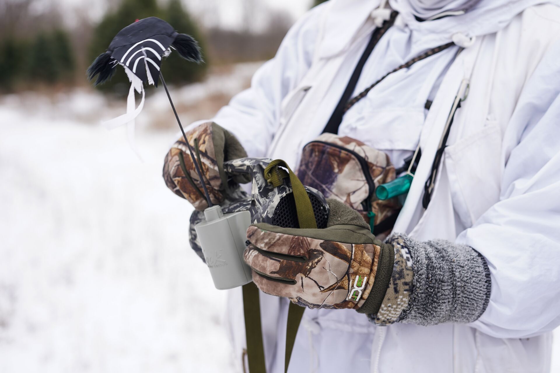 A hunter holds a motion decoy for hunting coyotes. 